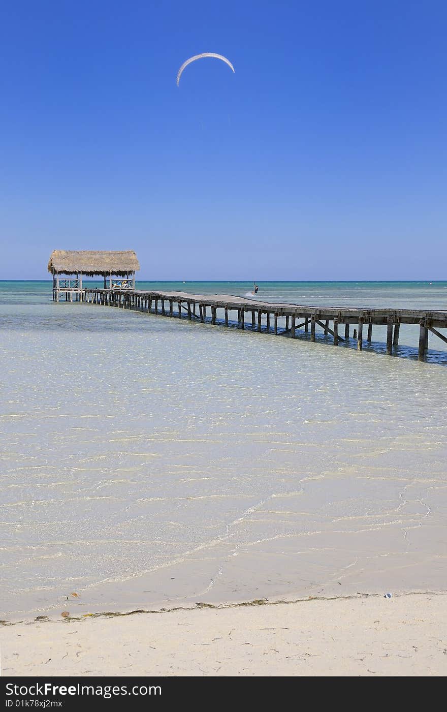 View of tropical cuban beach with wooden walkway, cayo coco. View of tropical cuban beach with wooden walkway, cayo coco.