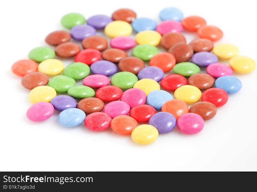 Colorful chocolate candies isolated on white background