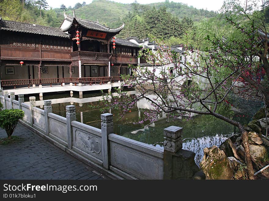 A typical chinese garden with a pond and statues,anhui,china.