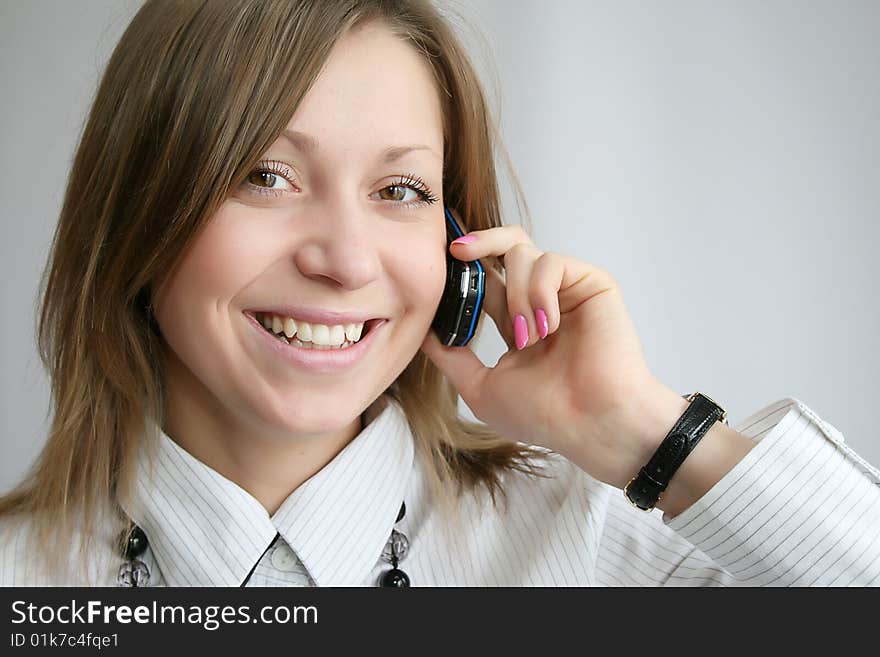 Attractive young woman calling by phone