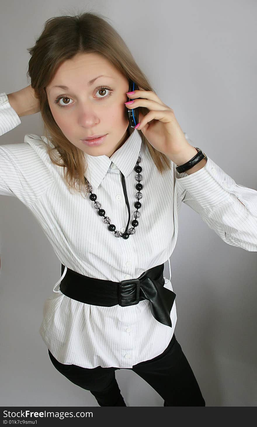 Attractive young woman calling by phone