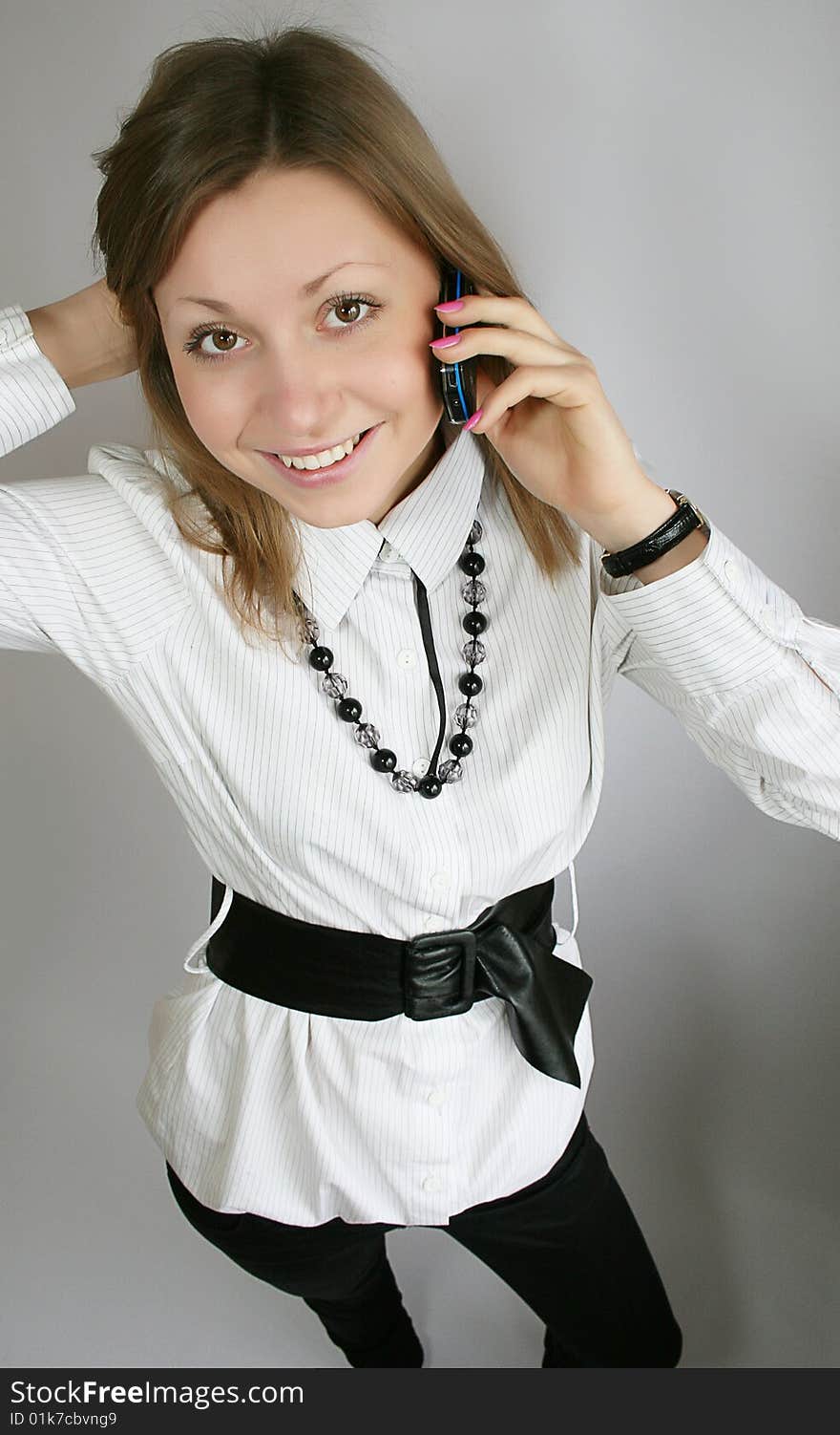 Attractive young woman calling by phone