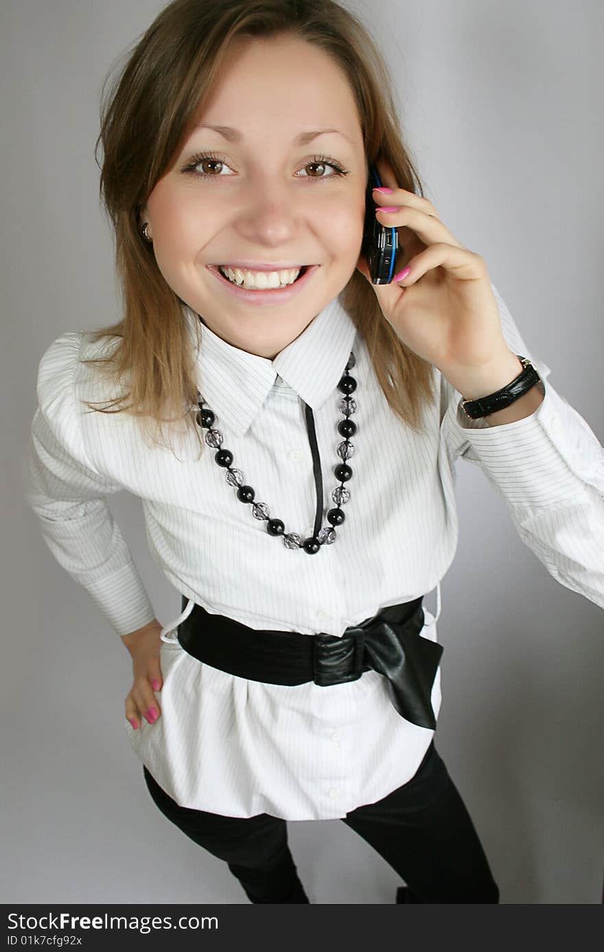 Attractive young woman calling by phone