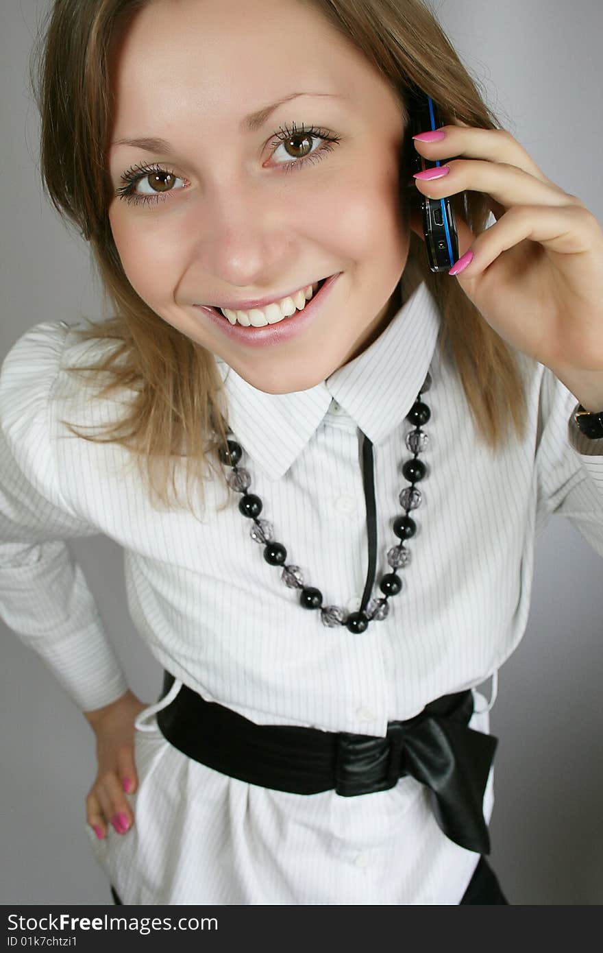 Attractive young woman calling by phone