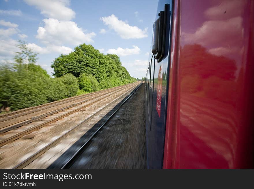 Railway tracks pictured from a speeding train. Railway tracks pictured from a speeding train