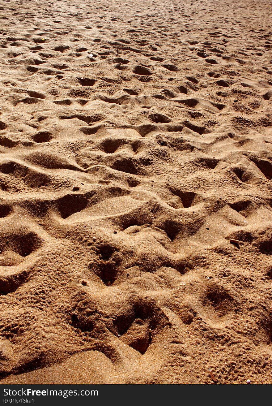 Trace of a foot of the person on sea sand. Trace of a foot of the person on sea sand