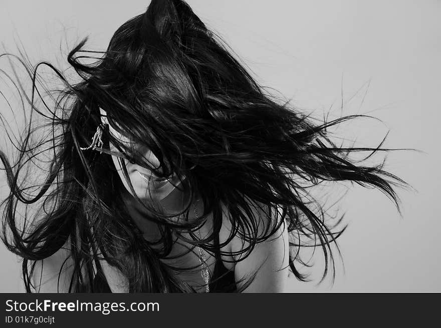 Portrait of young female beauty with long dark hair in black and white. Portrait of young female beauty with long dark hair in black and white