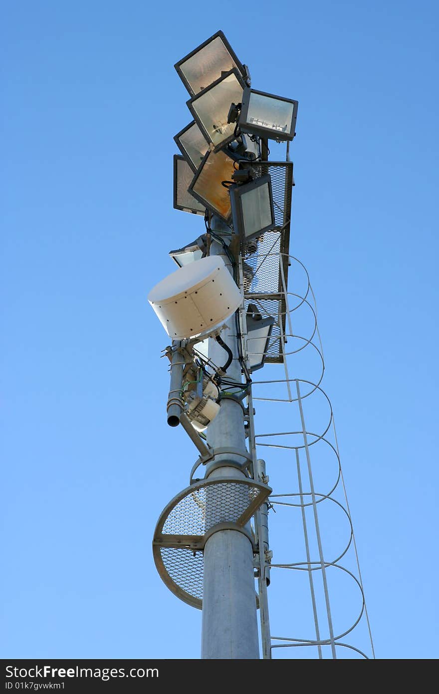 Stadium light pole in blue sky background