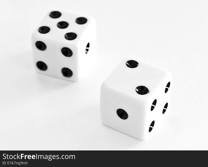 Close up of two dice on a white background. Close up of two dice on a white background