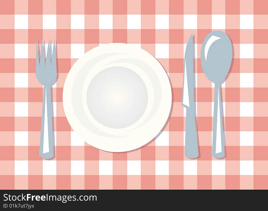 Table in kitchen with plate spoon knife and fork