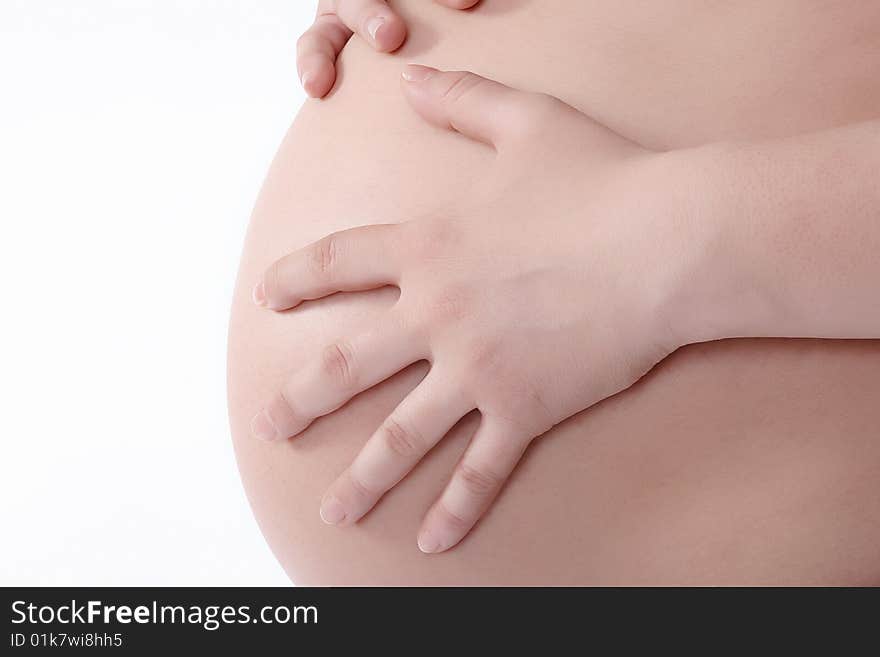 Pregnant woman holding hands closeup, studio shot. Pregnant woman holding hands closeup, studio shot