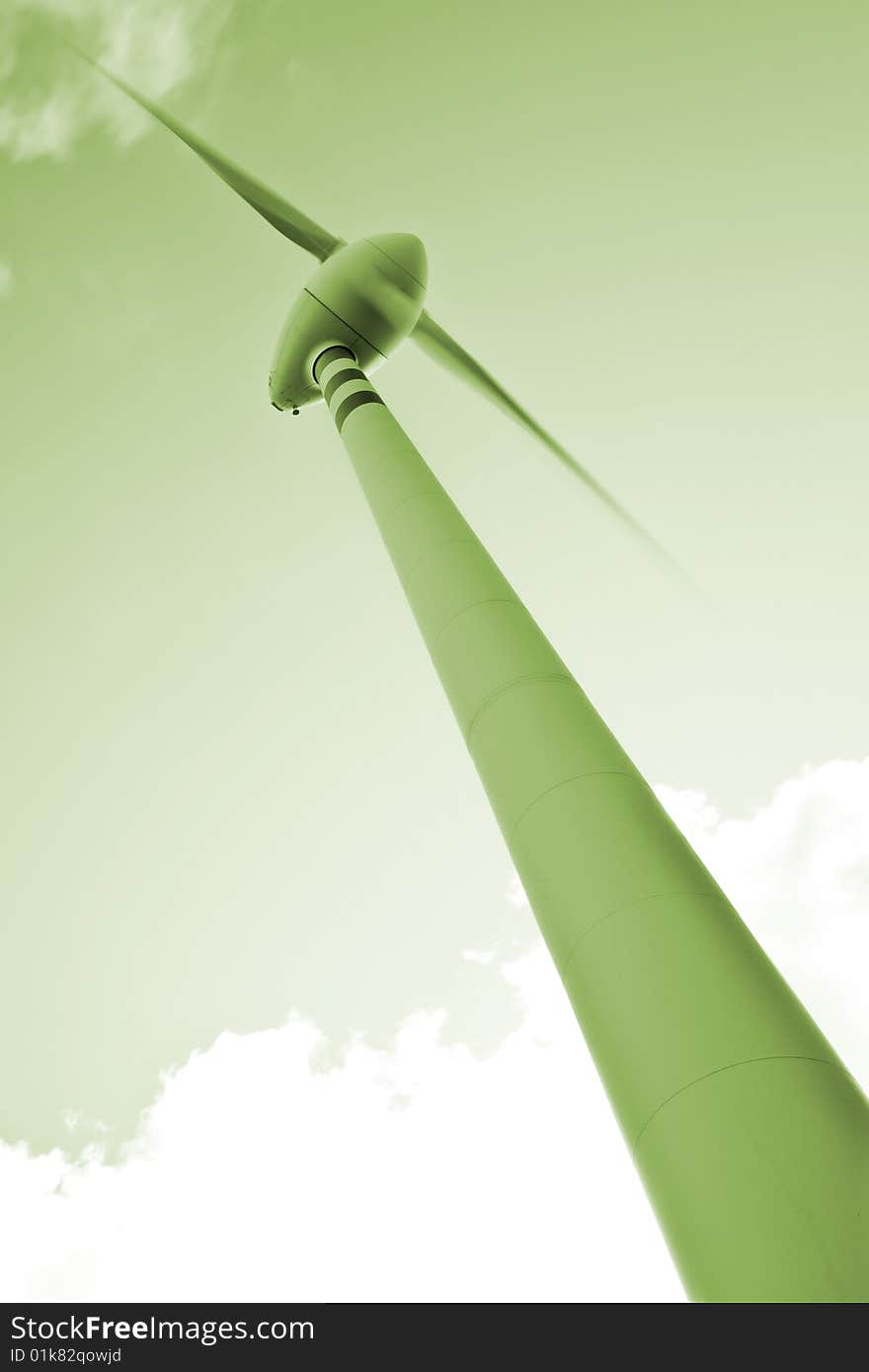 Panoramic view with a park of wind blades on top of a hill