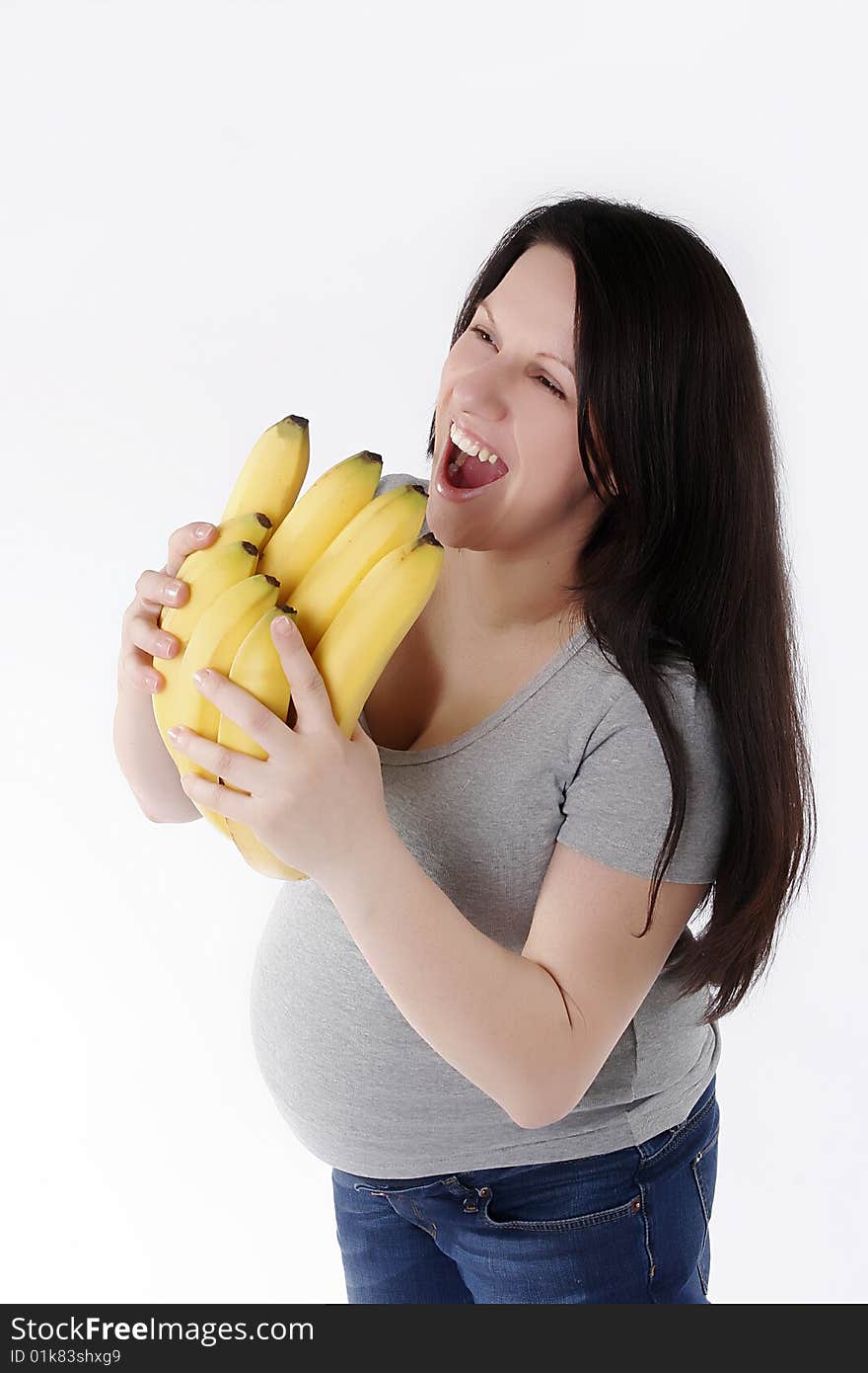 Pregnant woman with bananas isolated on white background