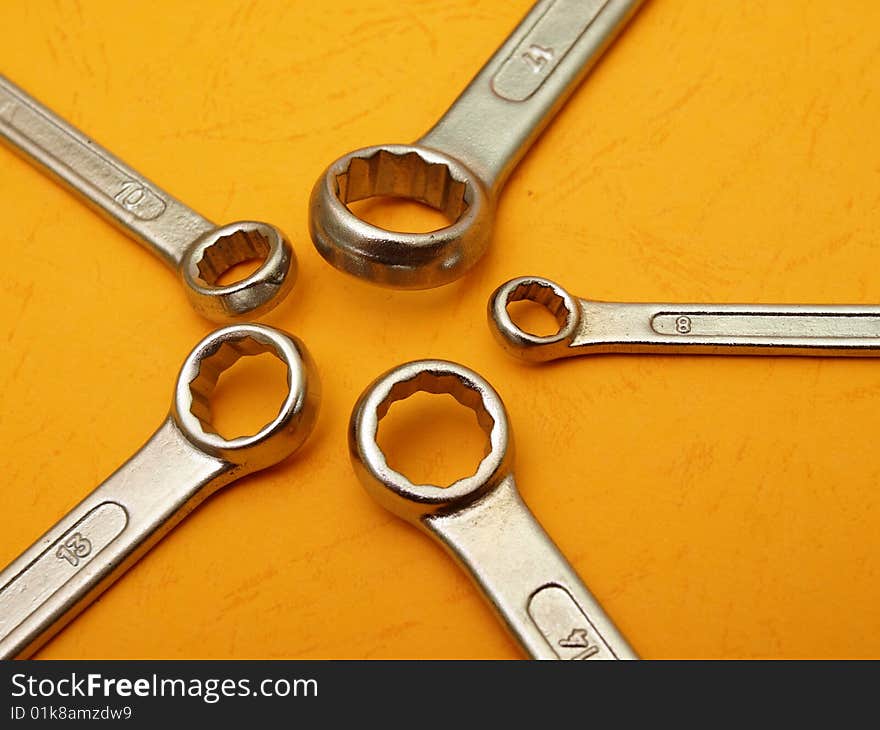 Box wrench head detail on contrasting orange background. Box wrench head detail on contrasting orange background