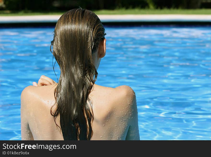 Girl bathing in the swimming pool. Girl bathing in the swimming pool