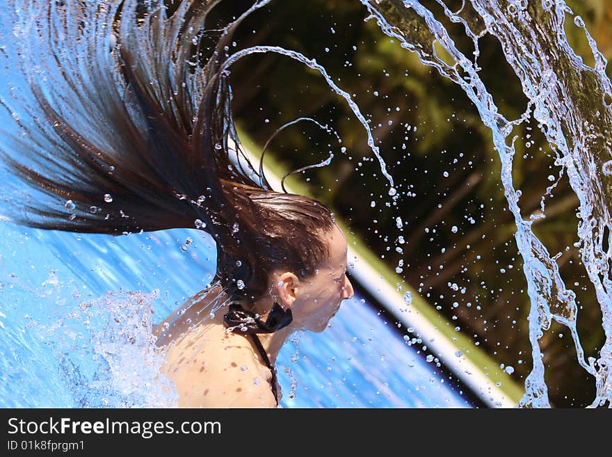 Woman takes a bath in the swimming pool. Woman takes a bath in the swimming pool