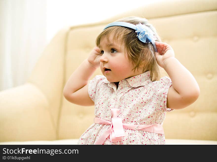 Little beautiful girl wears hoop