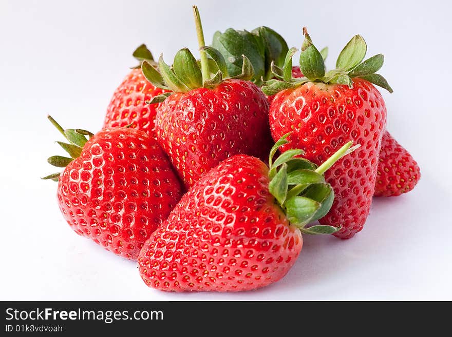 Ripe strawberries on a white background. Ripe strawberries on a white background