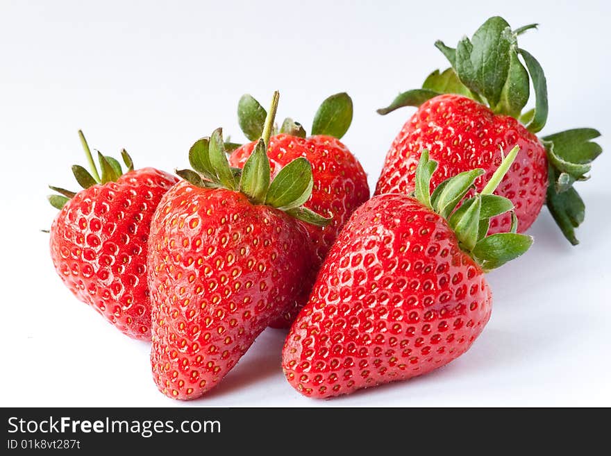 Ripe strawberries on a white background. Ripe strawberries on a white background