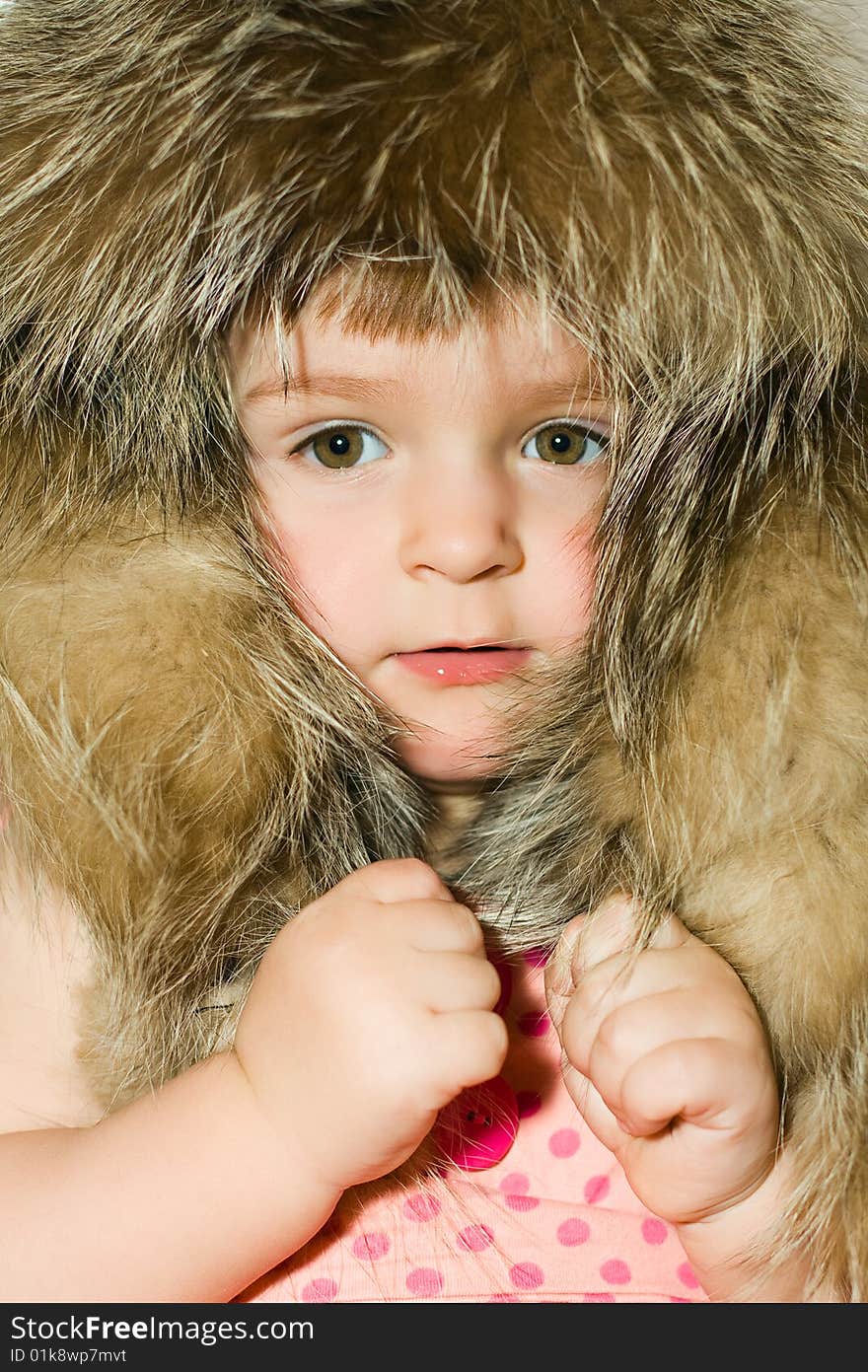 Baby in fur hat portrait. Baby in fur hat portrait