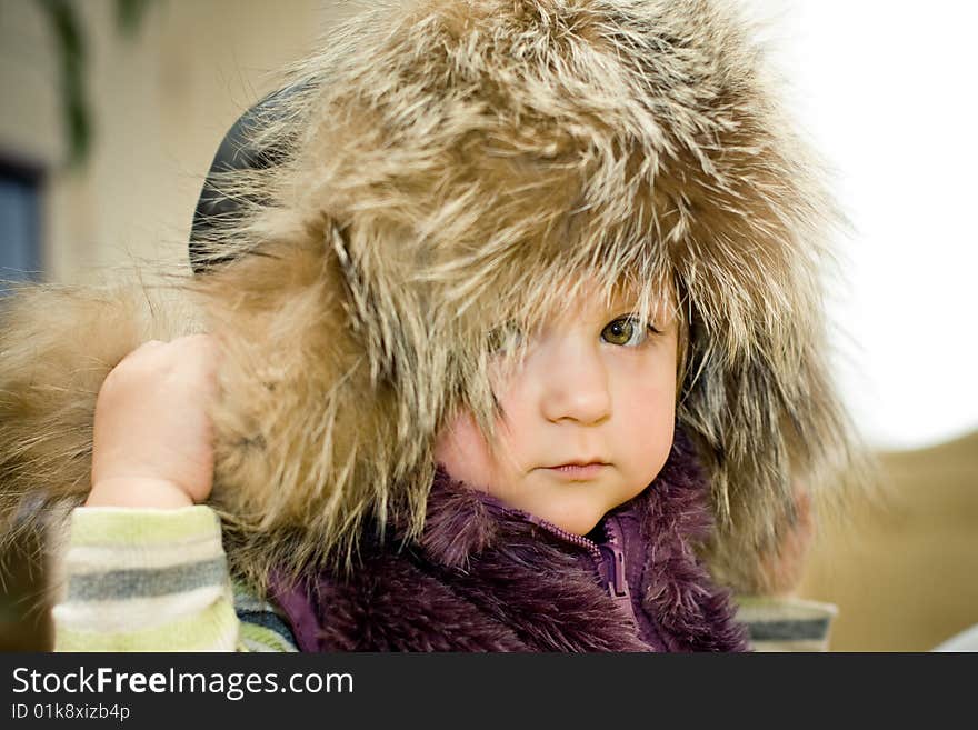 Baby in fur hat portrait. Baby in fur hat portrait