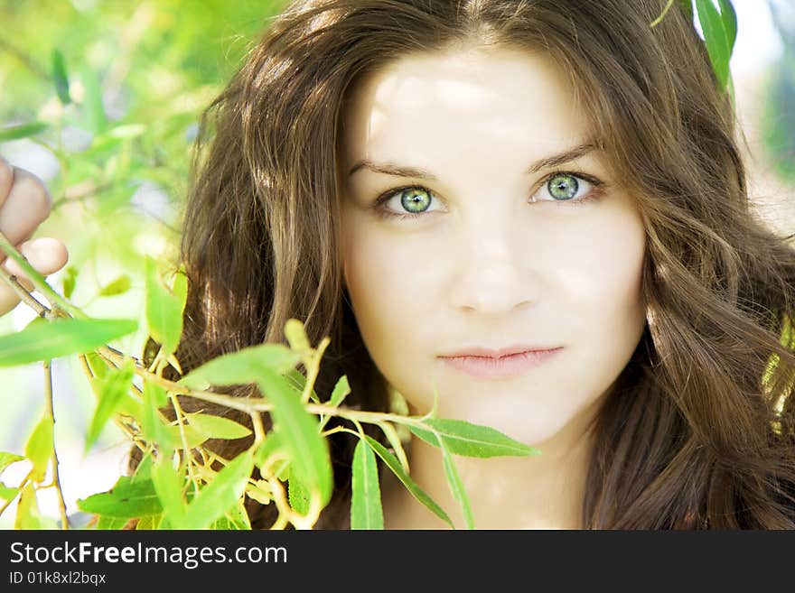 Beautiful girl on the grass in sunny day