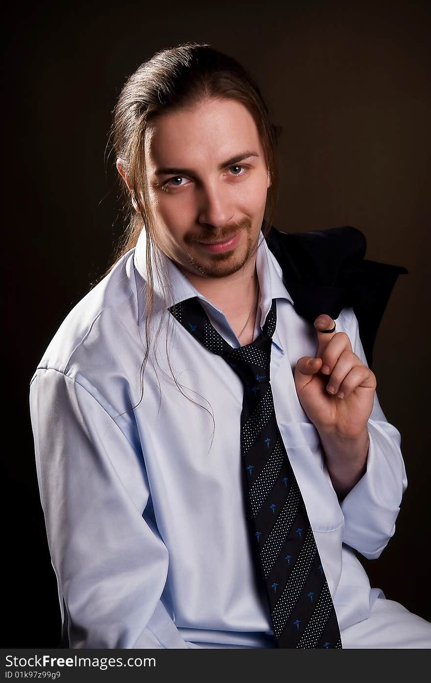 Portrait of young man with long hair