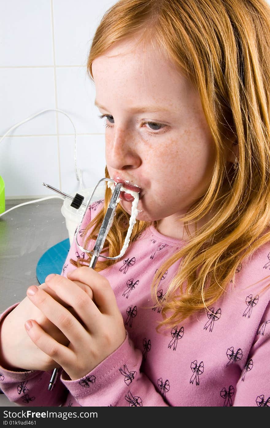 Girl is licking of whipped cream