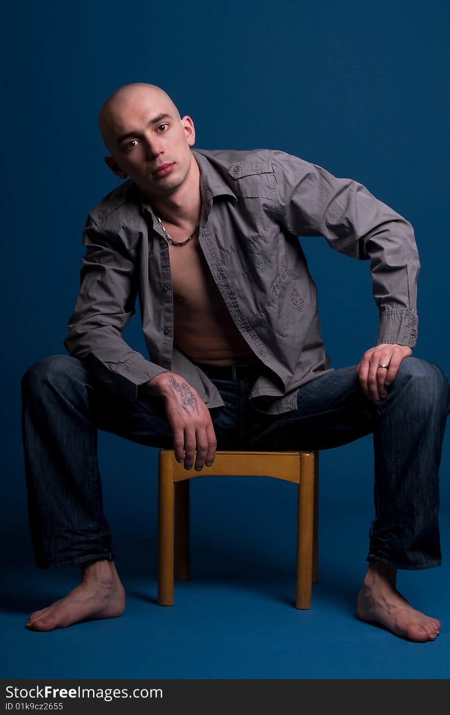 Portrait of young man on blue background