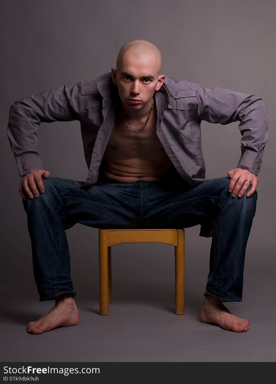 Portrait of young man on gray background