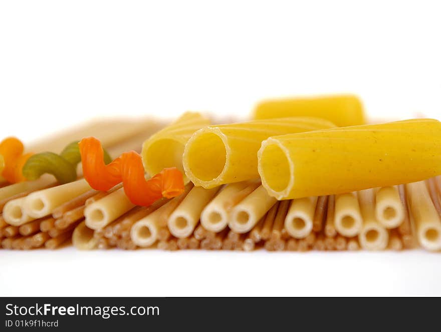 Colorful noodles frame on a white background. Soft focus. Colorful noodles frame on a white background. Soft focus