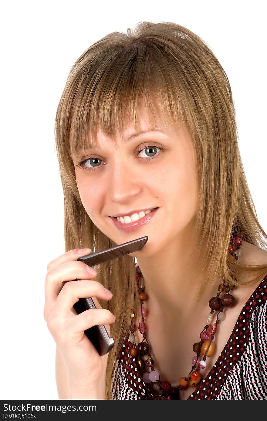 Young woman listens on a mobile phone