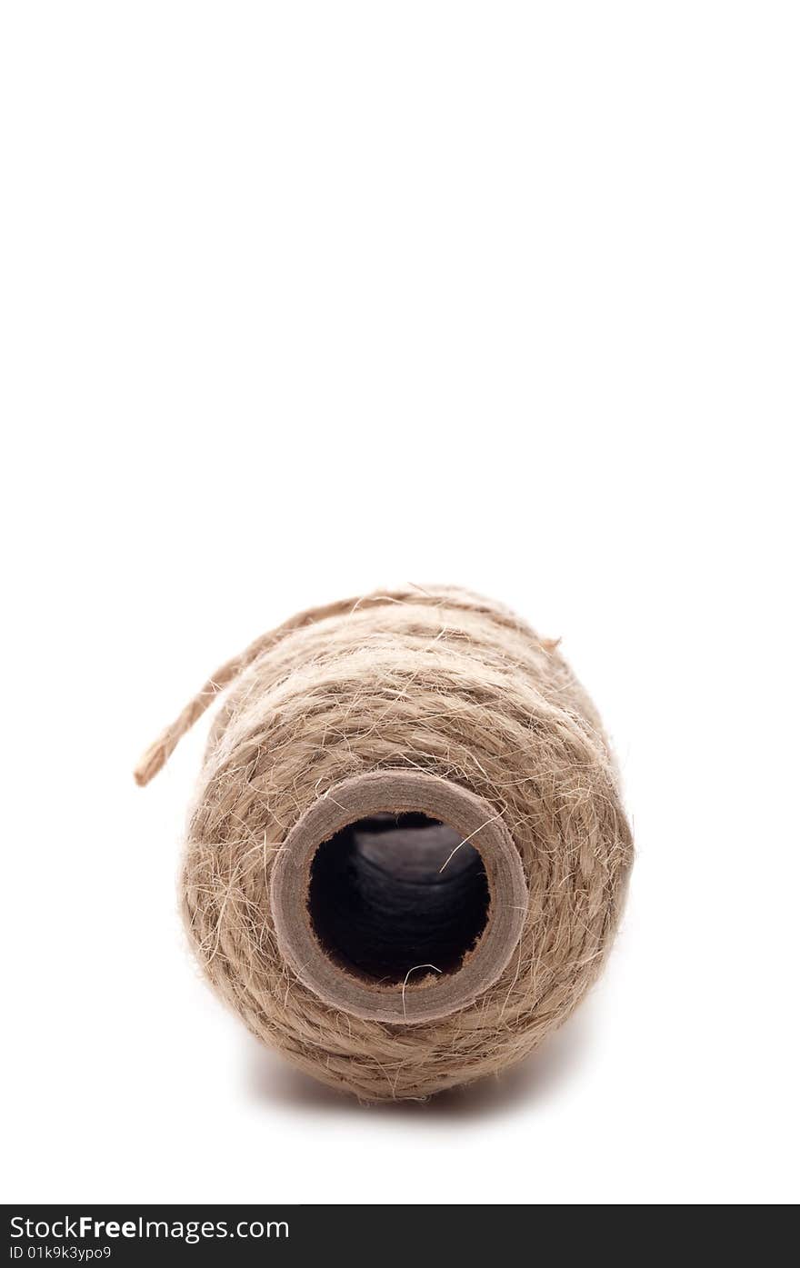 Vertical close up of the end of a spool of twine