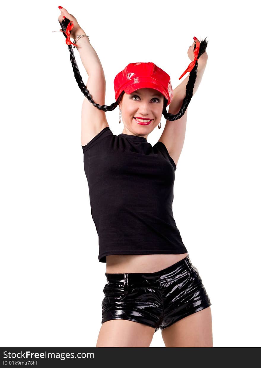 A young woman in black shorts and red lacquer lacquered cap dances. A young woman in black shorts and red lacquer lacquered cap dances.