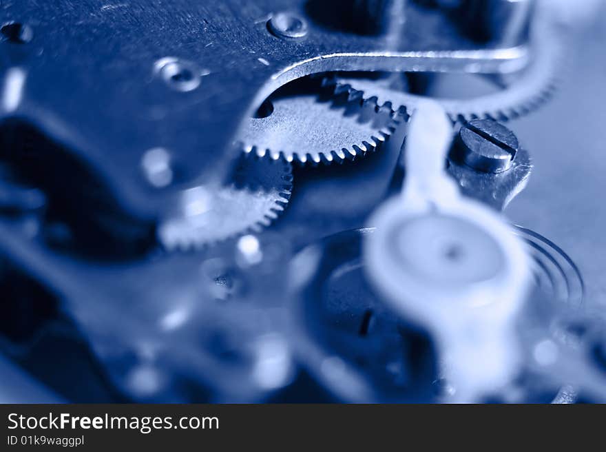 Cogs and wheels from the inside of an clock. Macro - low DOF.