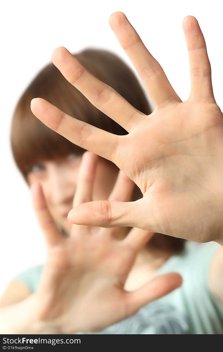 Young woman with hands over white