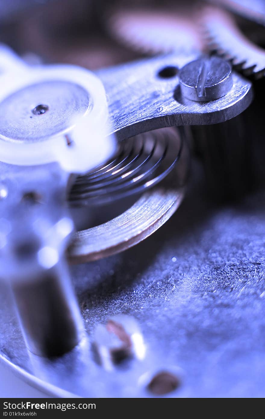 Cogs and wheels from the inside of an clock. Macro - low DOF.