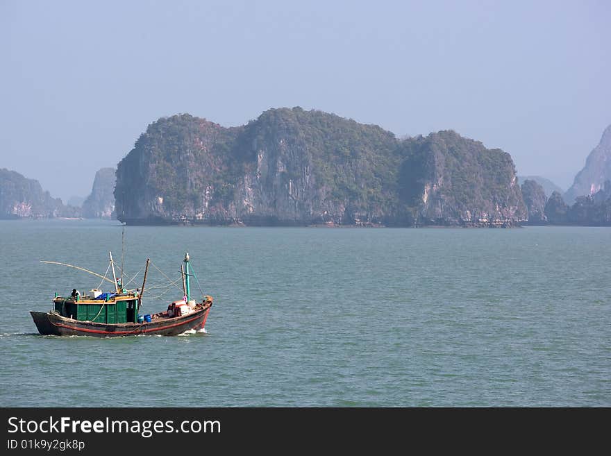 Boat and Islands in Halong Bay, Northern Vietnam