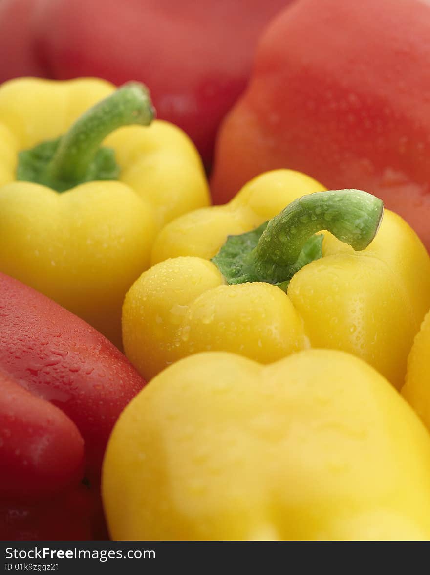 Group of Delicious Yellow and Red Bell Peppers with water drops. Group of Delicious Yellow and Red Bell Peppers with water drops.