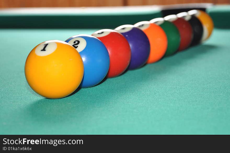 Billiard balls set in row, from one to nine, spectrum of colors. Billiard balls set in row, from one to nine, spectrum of colors