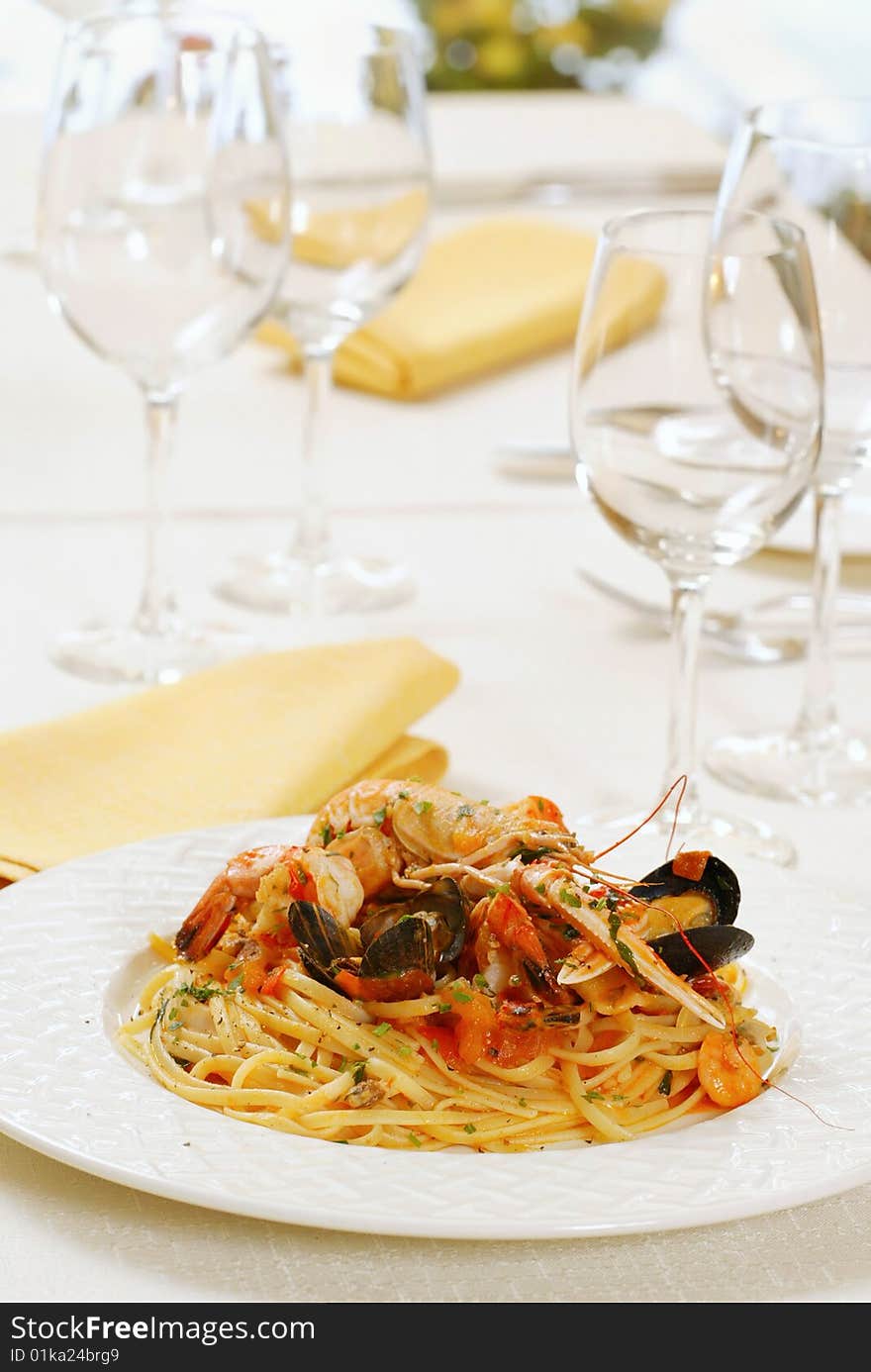 Pasta with seafood on white plate