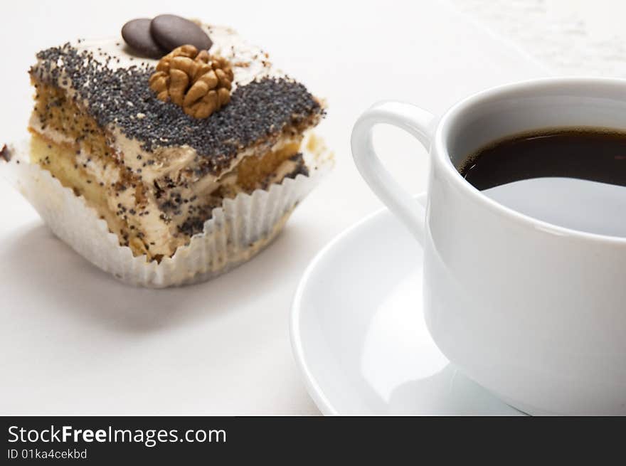 Close-up of a cup of coffee and pastry