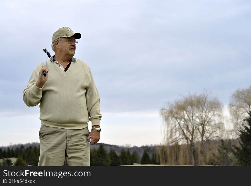 Senior male on golf course. Senior male on golf course