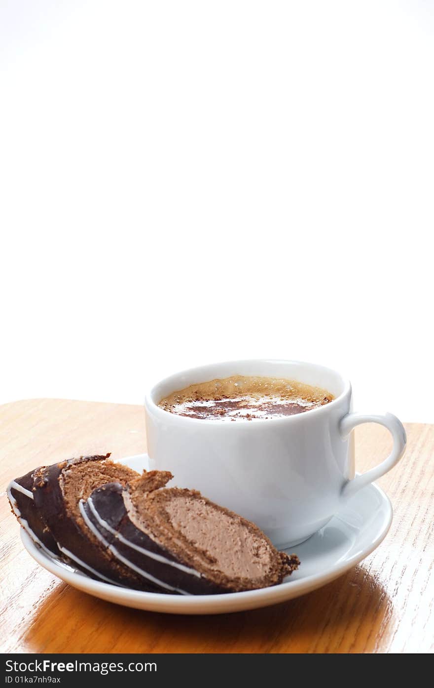 Isolated cup of coffee with dessert on the wooden table