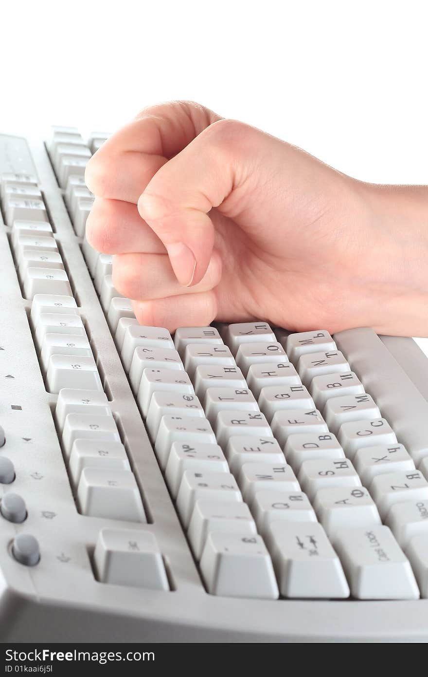 Fist on keyboard over white. Fist on keyboard over white