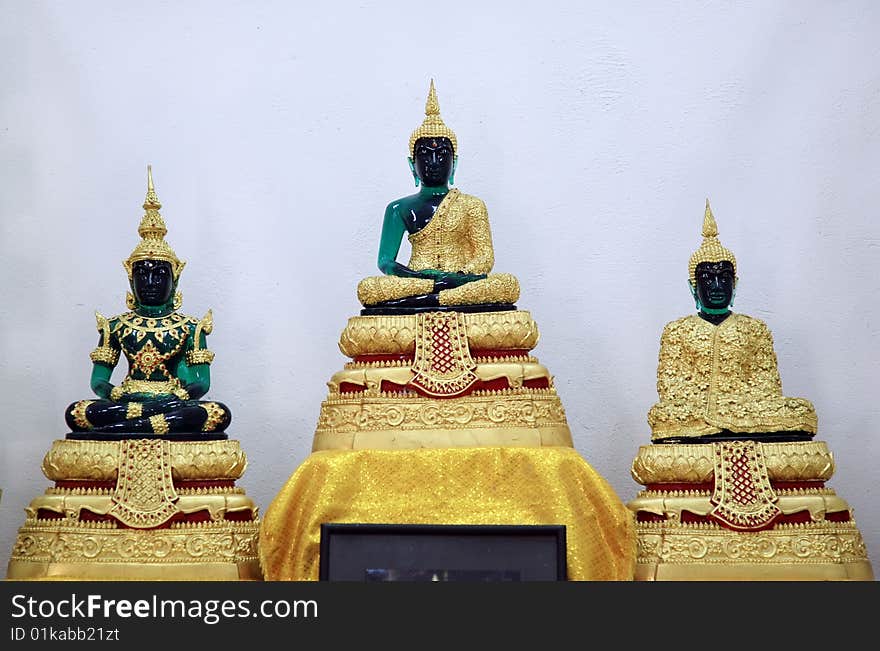 Statue of buddha over a white background.