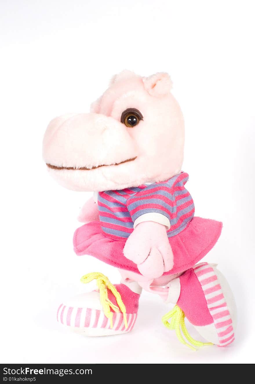 Toy hippopotamus rose colour on white background