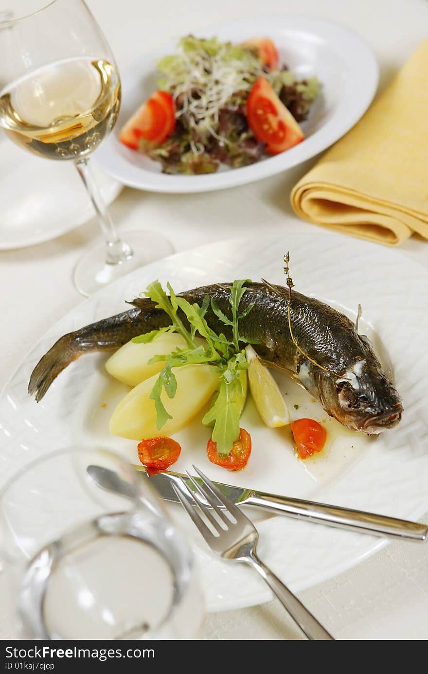 Big prepared fish on white plate. Big prepared fish on white plate