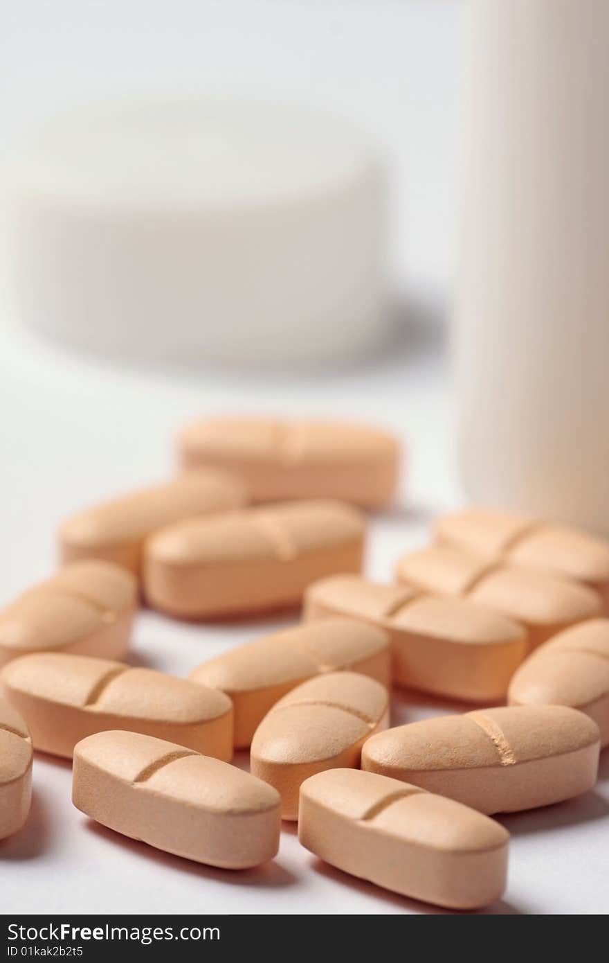 Orange pills and buttle closeup