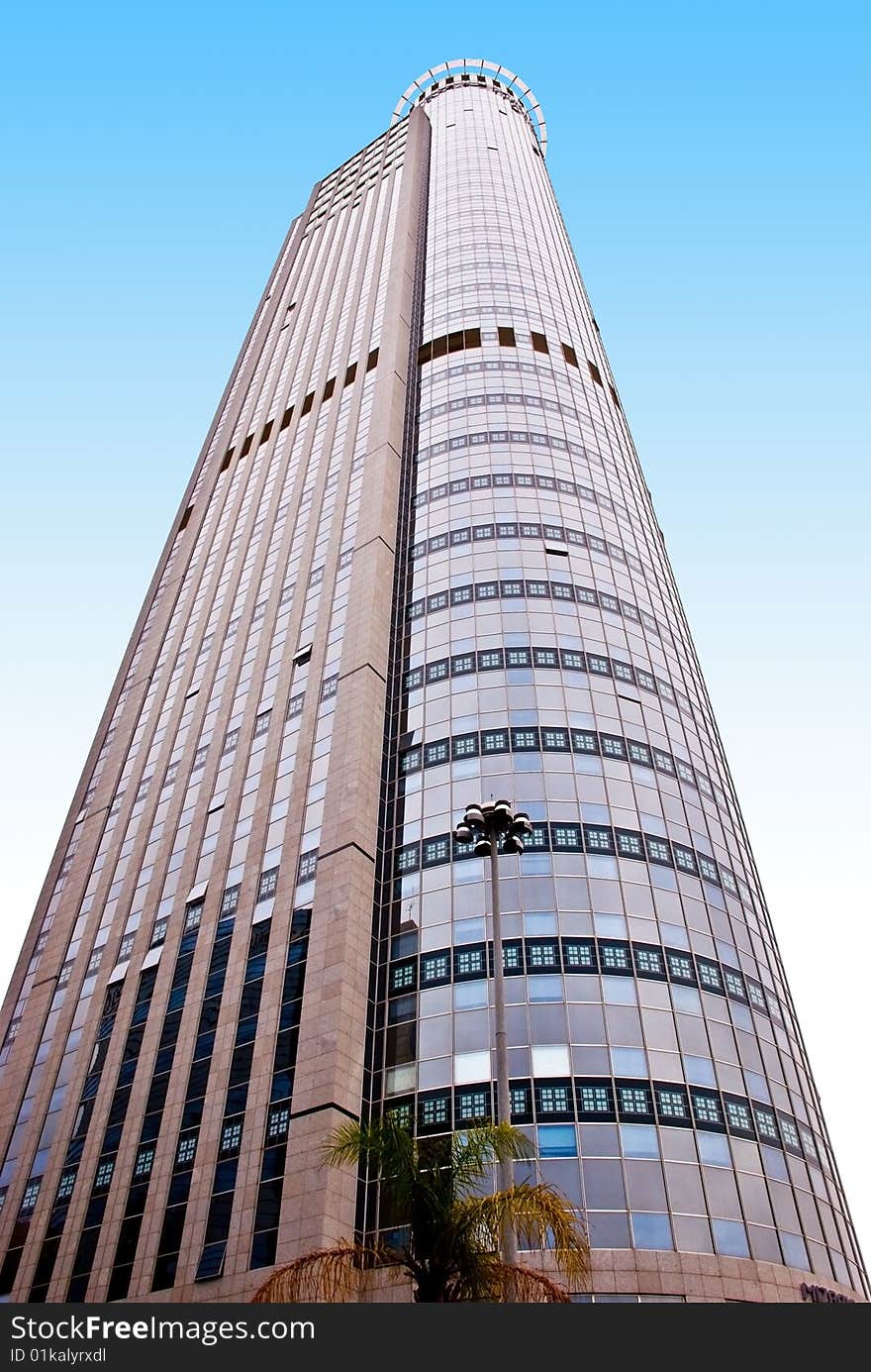 A high modern office building. A view from below. A high modern office building. A view from below.